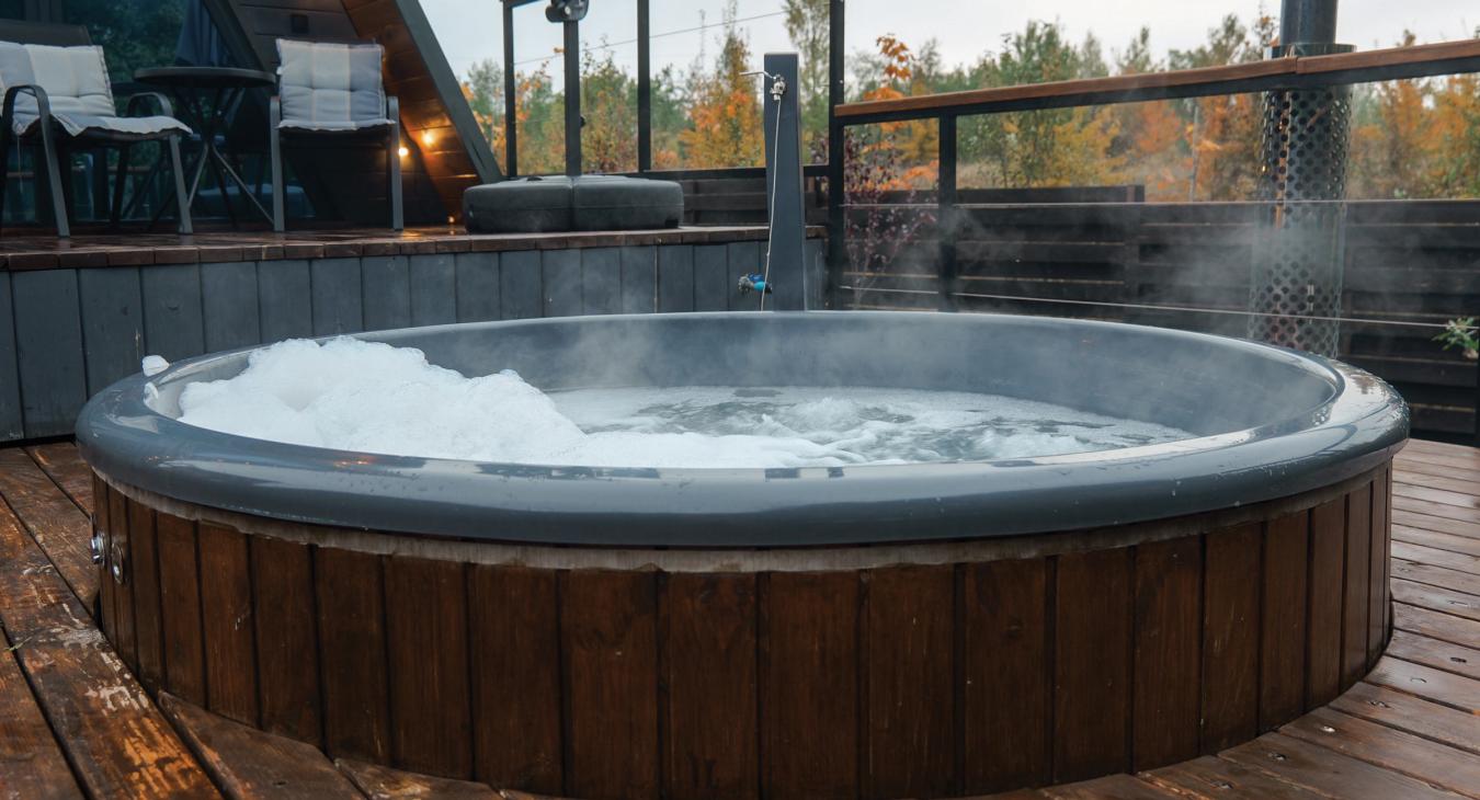 A large hot tub on an outdoor deck