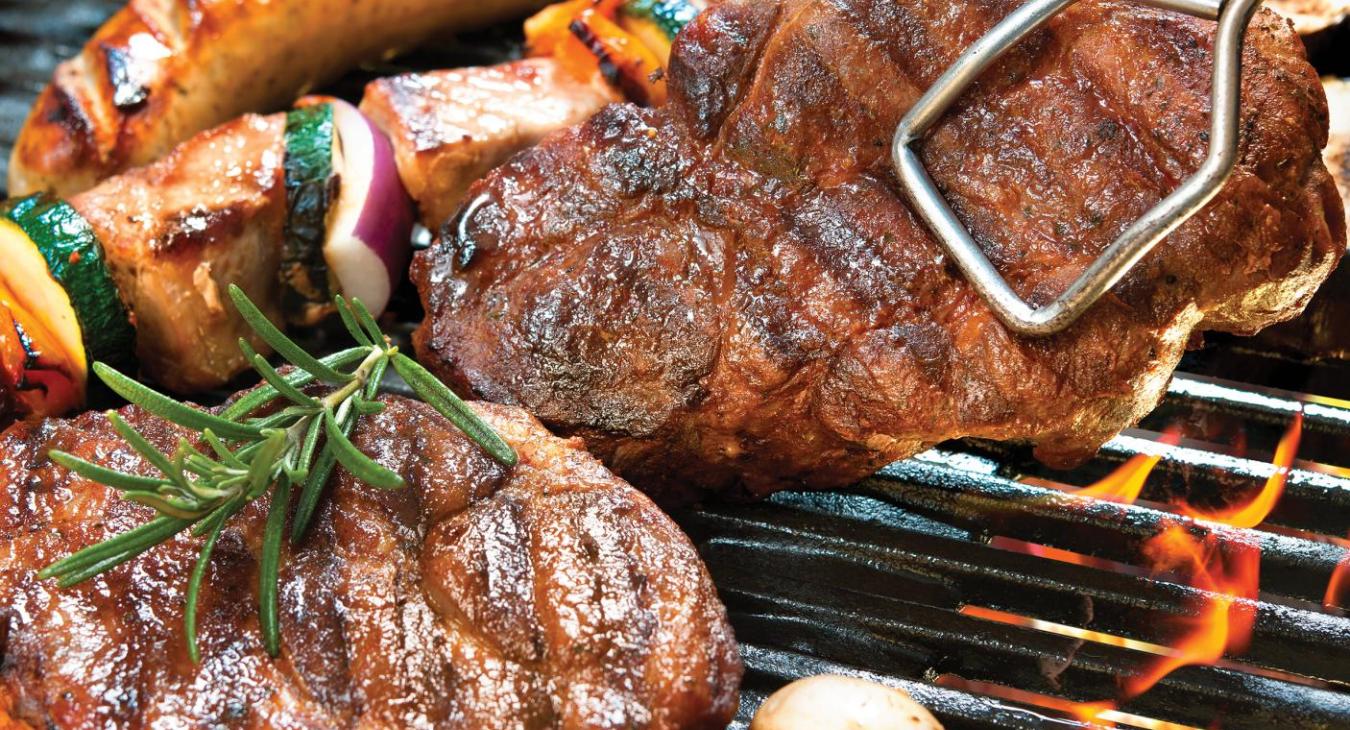 Steak, brats and veggies on the grill